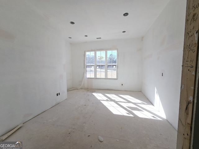 unfurnished room featuring visible vents