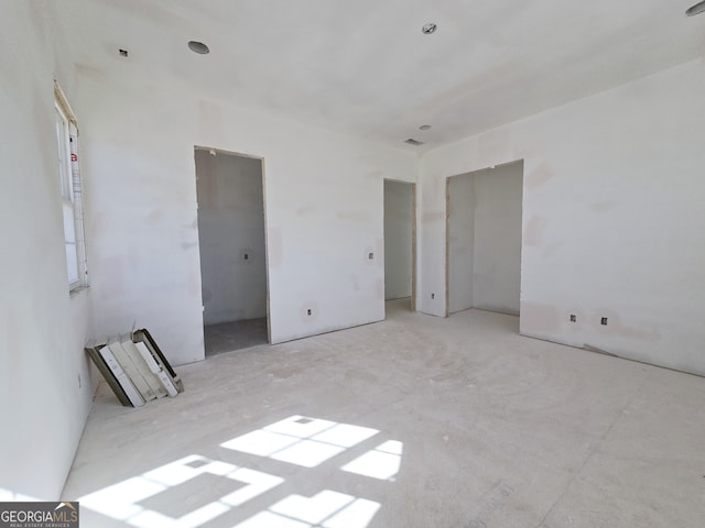 unfurnished bedroom with visible vents