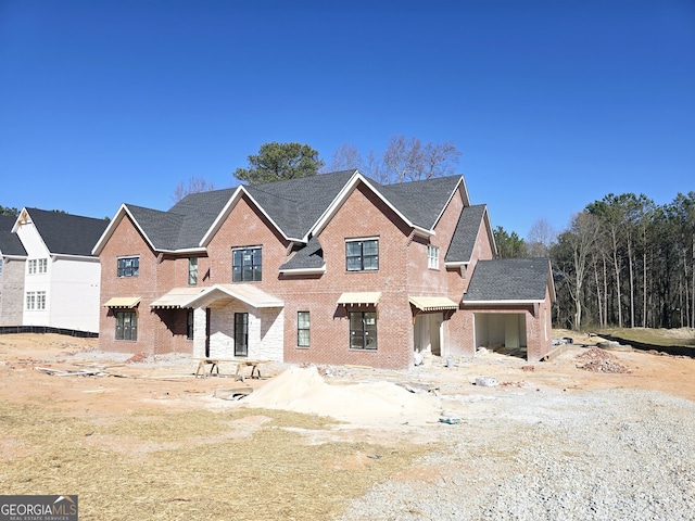 view of front of property featuring brick siding