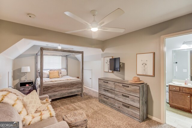 1433 Henderson Ridge Ln, Loganville, GA 30052 - bedroom featuring light carpet, baseboards, a ceiling fan, and ensuite bathroom