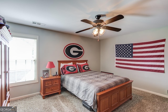 1433 Henderson Ridge Ln, Loganville, GA 30052 - carpeted bedroom with ceiling fan, visible vents, and baseboards