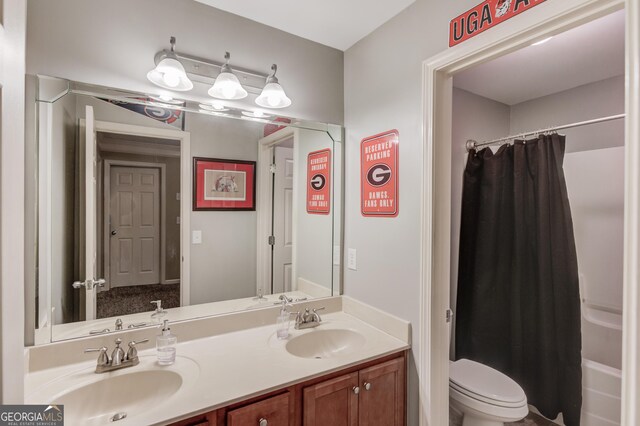 1433 Henderson Ridge Ln, Loganville, GA 30052 - bathroom with double vanity, shower / bath combo, a sink, and toilet