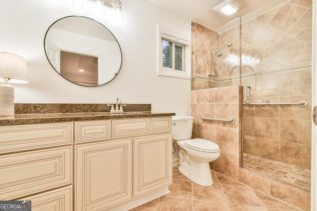 full bathroom with vanity, a shower stall, toilet, and tile patterned floors