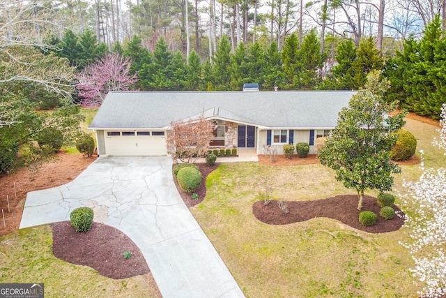 view of front of home featuring concrete driveway, an attached garage, and stone siding