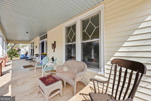 view of patio featuring a porch