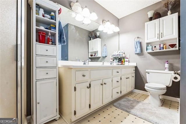 full bath featuring baseboards, vanity, toilet, and tile patterned floors