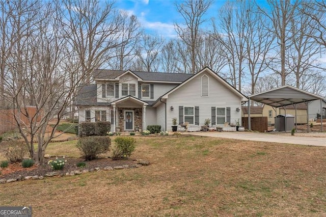 traditional-style home with an outdoor structure, fence, driveway, a carport, and a front lawn