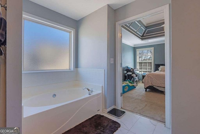 ensuite bathroom with ensuite bathroom, ornamental molding, and a bath