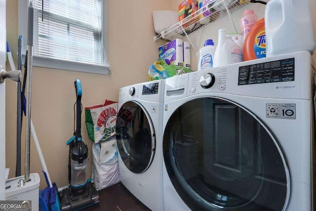 laundry area with laundry area and separate washer and dryer