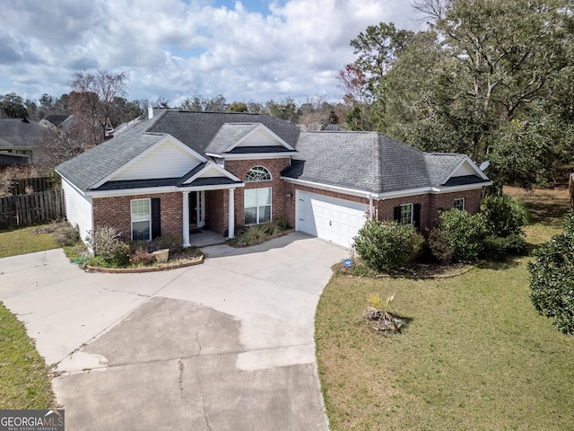 view of front of home featuring brick siding, concrete driveway, fence, a garage, and a front lawn