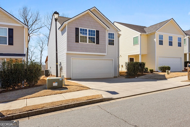 view of front facade featuring central AC unit, driveway, a chimney, and a garage