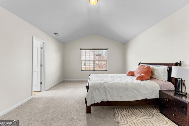 bedroom with lofted ceiling, baseboards, visible vents, and light carpet