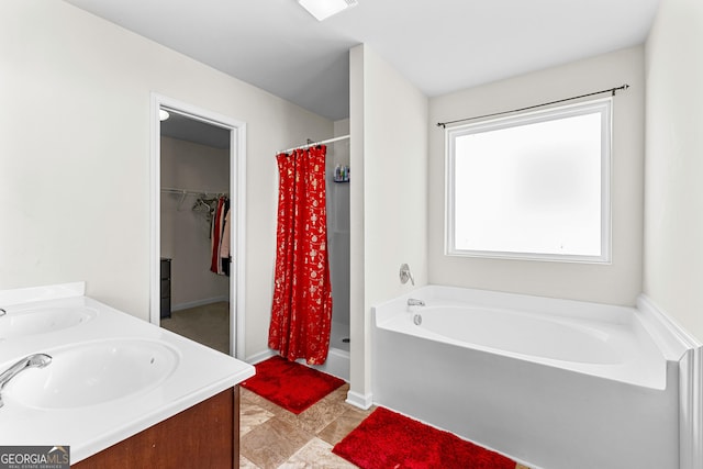 full bath featuring a garden tub, visible vents, a stall shower, and a sink