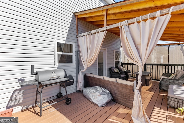 deck with area for grilling and an outdoor living space