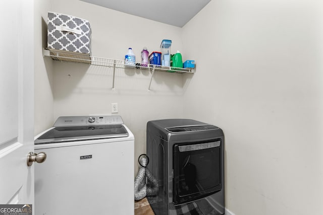 washroom with laundry area and independent washer and dryer