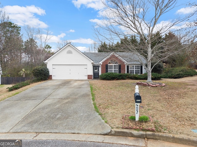 single story home featuring brick siding, concrete driveway, fence, a garage, and a front lawn