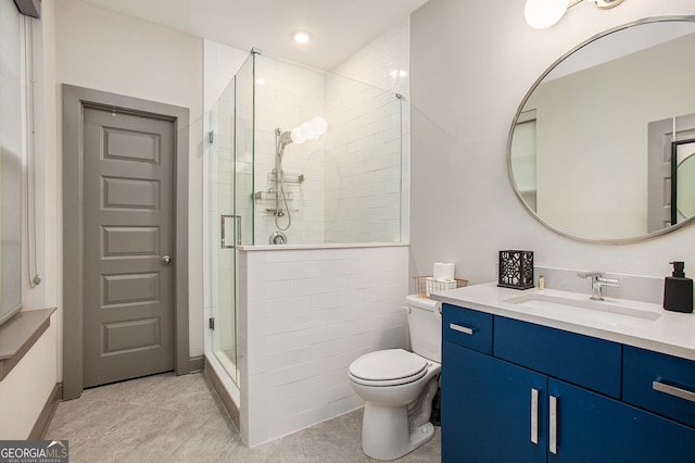 full bathroom featuring a stall shower, vanity, toilet, and recessed lighting