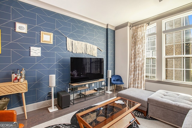 living room featuring baseboards and wood finished floors