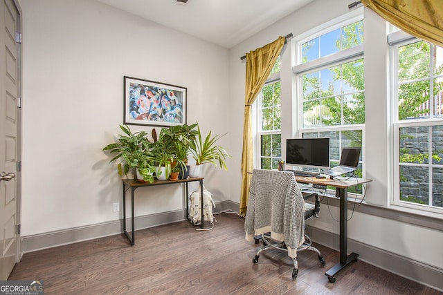 office area with baseboards and wood finished floors