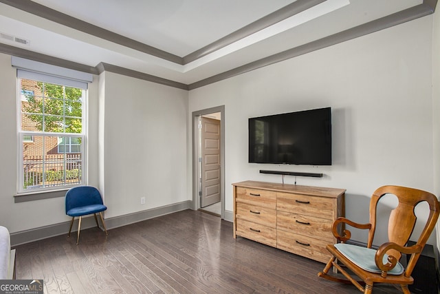 sitting room with dark wood-style floors, visible vents, and baseboards