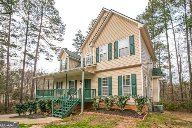 view of front of property featuring covered porch and cooling unit