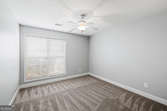 1409 Nantucket Dr, Bethlehem, GA 30620 - empty room featuring a ceiling fan, carpet, and a textured ceiling