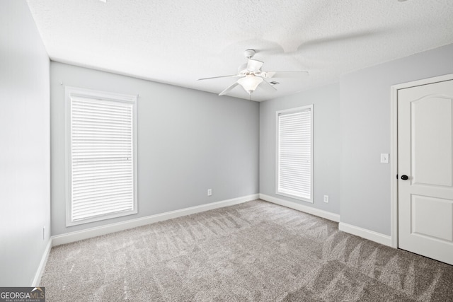 1409 Nantucket Dr, Bethlehem, GA 30620 - carpeted spare room with ceiling fan and a textured ceiling