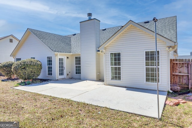1409 Nantucket Dr, Bethlehem, GA 30620 - rear view of property with roof with shingles, a chimney, and a patio