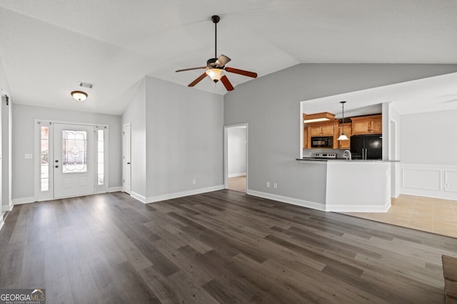 1409 Nantucket Dr, Bethlehem, GA 30620 - unfurnished living room featuring lofted ceiling, dark wood-style flooring, and a ceiling fan