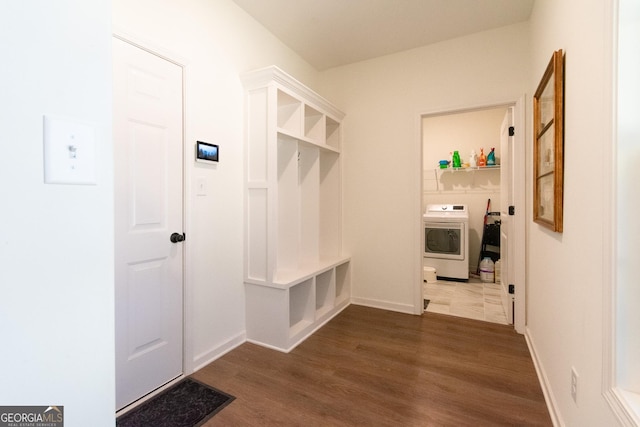 mudroom with washer / clothes dryer and dark wood-style flooring