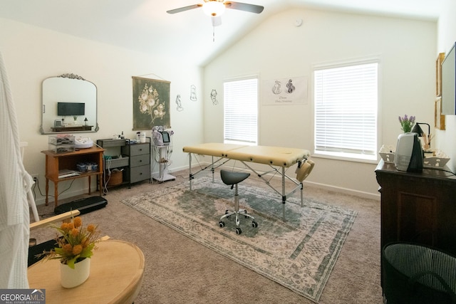 carpeted home office featuring lofted ceiling, baseboards, and a ceiling fan