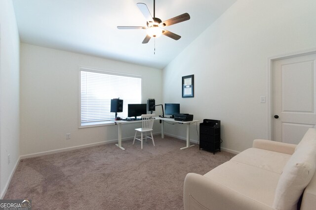 office space with high vaulted ceiling, carpet, baseboards, and ceiling fan