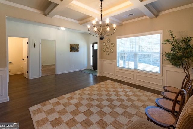 entryway with coffered ceiling, wood finished floors, visible vents, beamed ceiling, and an inviting chandelier