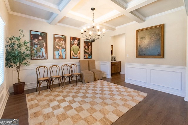 sitting room with a chandelier, beamed ceiling, coffered ceiling, and wood finished floors