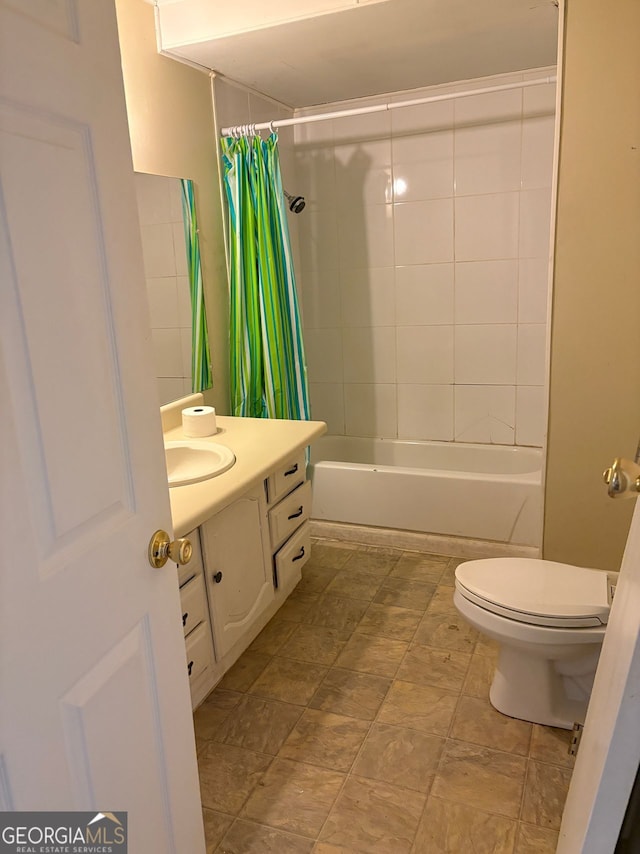 bathroom featuring shower / bath combination with curtain, vanity, and toilet