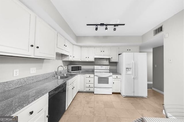 kitchen with white appliances, a sink, visible vents, and white cabinets