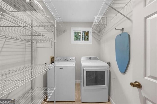 washroom with laundry area and washing machine and clothes dryer