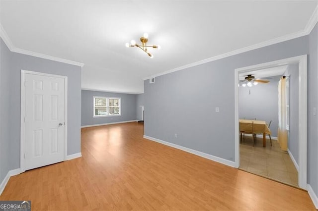 unfurnished living room featuring light wood-style flooring, baseboards, and crown molding