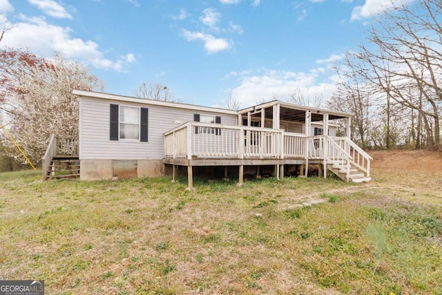 view of front of property featuring stairway and a wooden deck