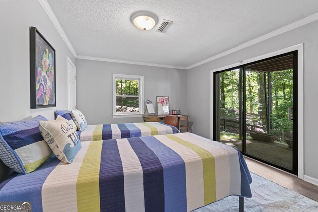 3928 Lake Ct, Gainesville, GA 30501 - bedroom featuring a textured ceiling, visible vents, access to exterior, and ornamental molding