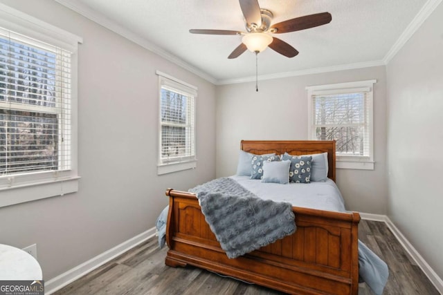 bedroom with ceiling fan, ornamental molding, wood finished floors, and baseboards