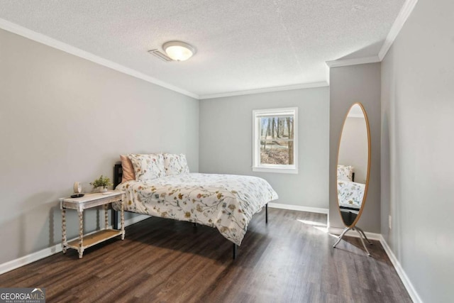 bedroom featuring crown molding, dark wood finished floors, a textured ceiling, and baseboards