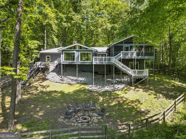 3928 Lake Ct, Gainesville, GA 30501 - back of house with a sunroom, an outdoor fire pit, stairway, and a deck