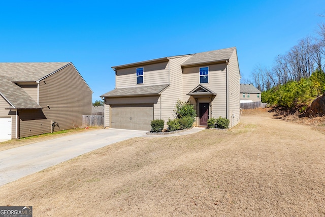 view of front of property featuring concrete driveway, fence, and a garage