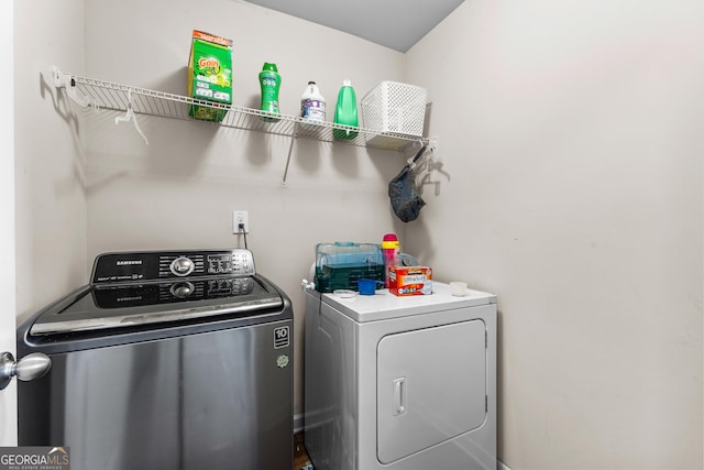 laundry room featuring laundry area and washing machine and clothes dryer