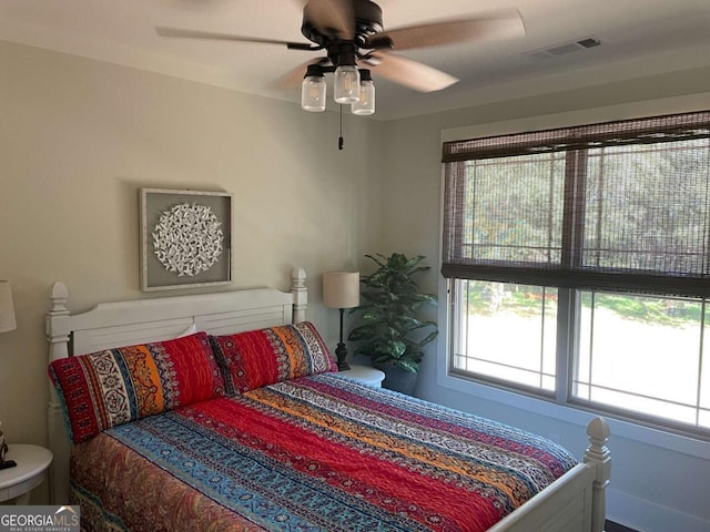 bedroom featuring a ceiling fan and visible vents