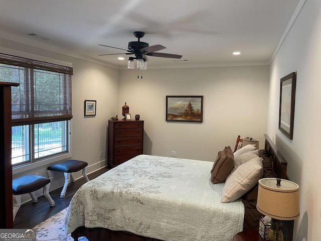 bedroom with ornamental molding, dark wood-type flooring, recessed lighting, and baseboards