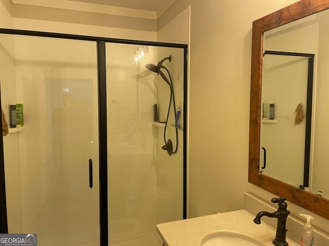 bathroom featuring a stall shower and vanity