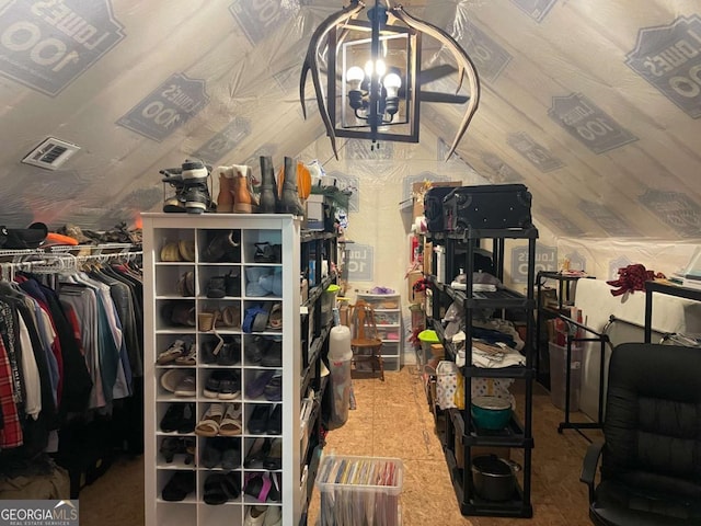 interior space featuring a chandelier and vaulted ceiling