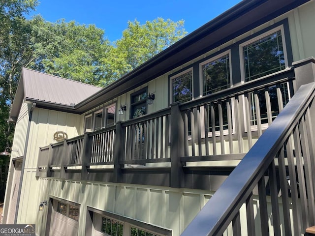 view of home's exterior with board and batten siding and metal roof